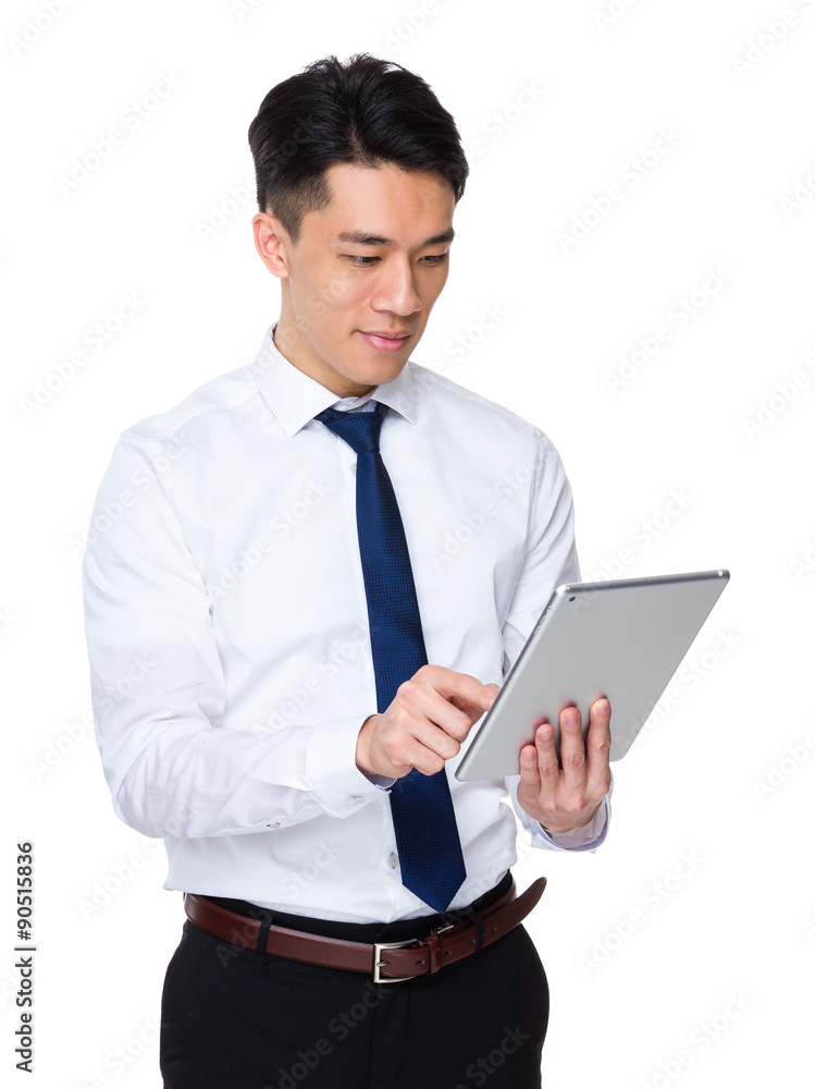 Asian businessman use of the tablet pc Asian businessman use of the tablet pc