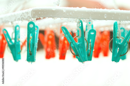 vintage clothespin on rainyday with selective focus on peg