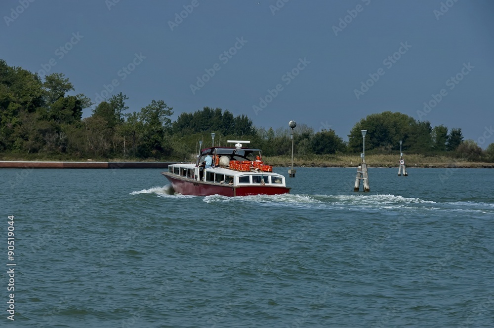 Obraz premium One boat in venetian lagoon, Italy
