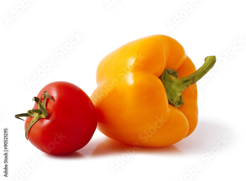 fresh tomato and orange bell pepper on white background 