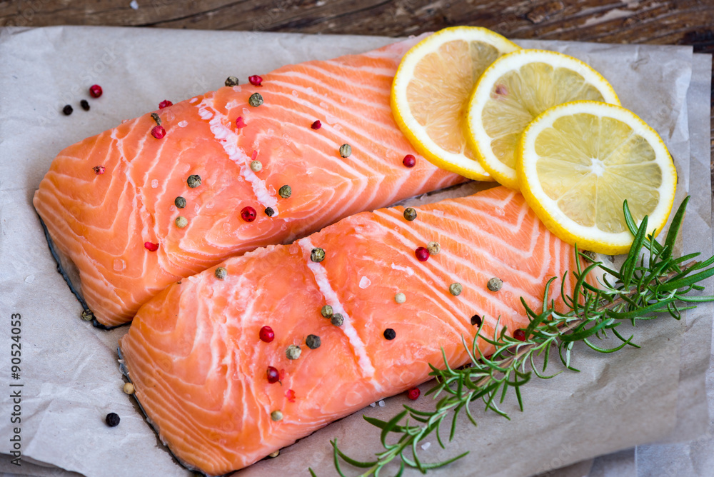 Raw Salmon Fish Fillet with Lemon, Spices and Fresh Herbs Raw Salmon Fish Fillet with Lemon, Spices and Fresh Herbs
