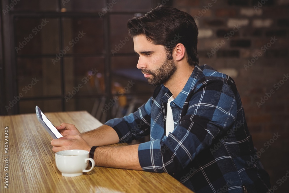Young man using his tablet Young man using his tablet