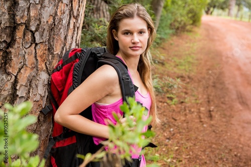 Pretty blonde hiker with backpack