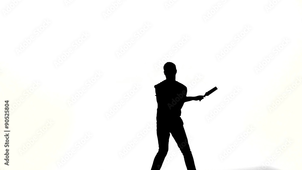 silhouette of barman showing tricks with a bottle silhouette of barman showing tricks with a bottle
