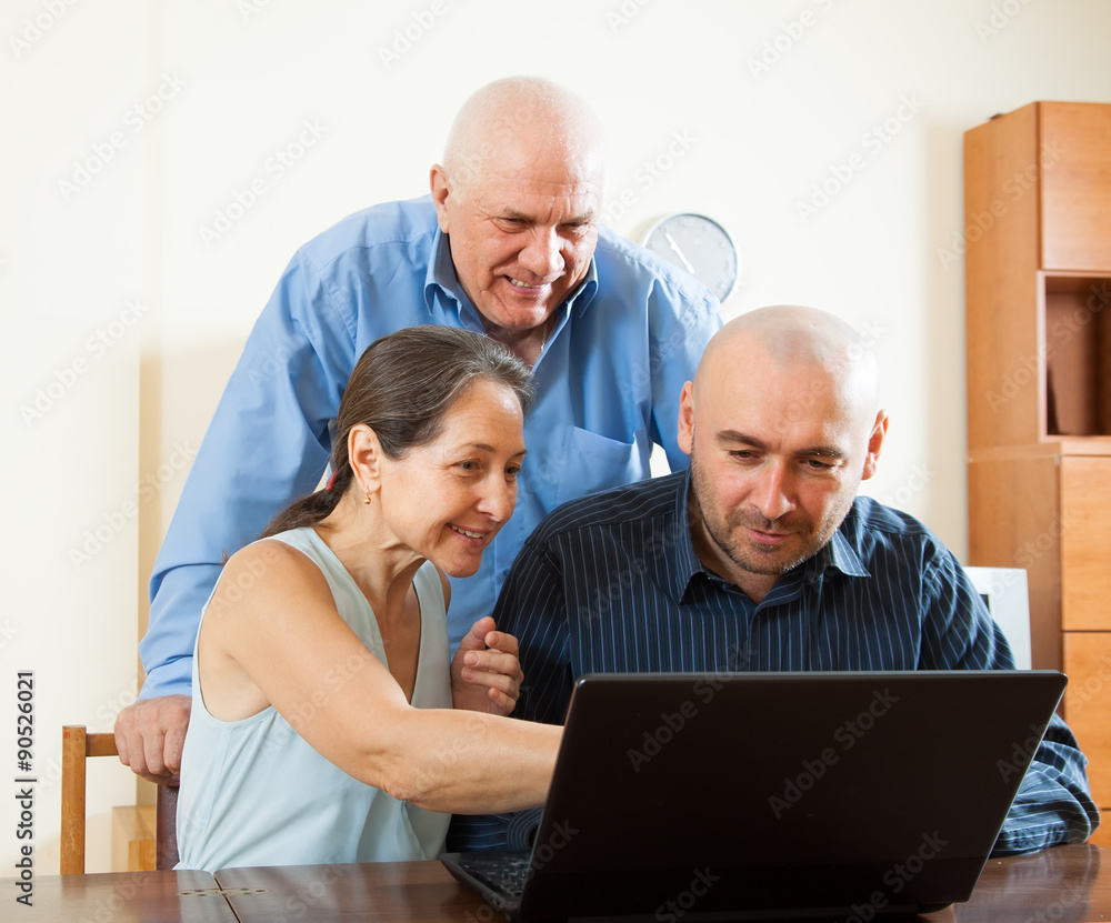 Manager helping with laptop Manager helping with laptop