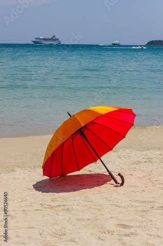 Orange umbrella on the beach