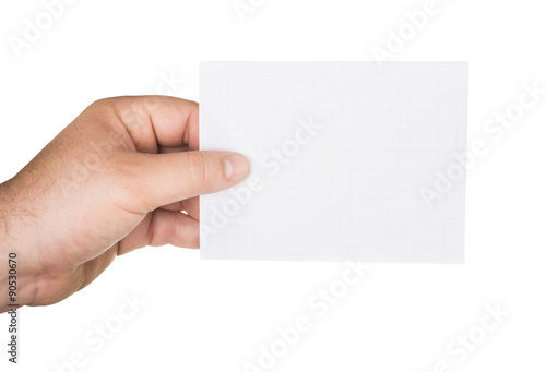 man's hand holding a paper sheet