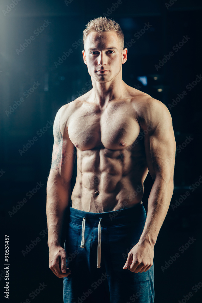 Silhouette of a athlete. Confident young fitness man with strong