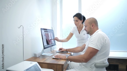 Two dentists having a professional discussion photo