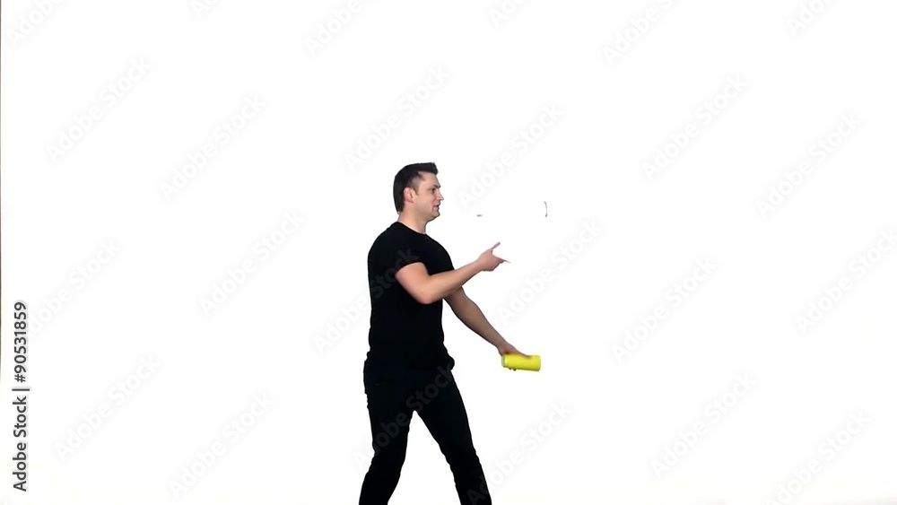 Young bartender does a trick with a shaker. slow motion Young bartender does a trick with a shaker. slow motion