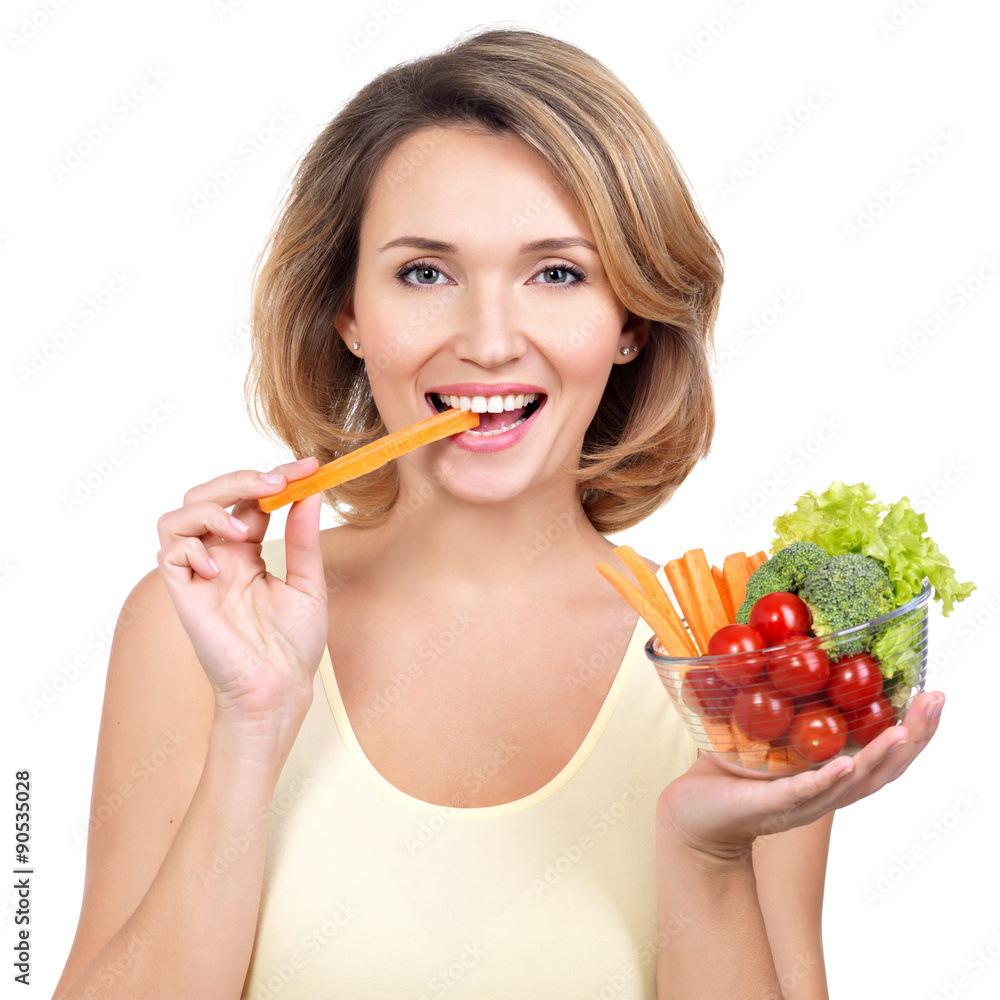 Beautiful young healthy woman eating a salad. Beautiful young healthy woman eating a salad.