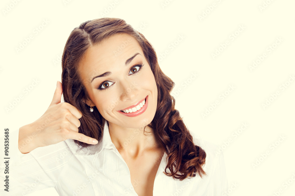 Businesswoman with call me gesture Businesswoman with call me gesture