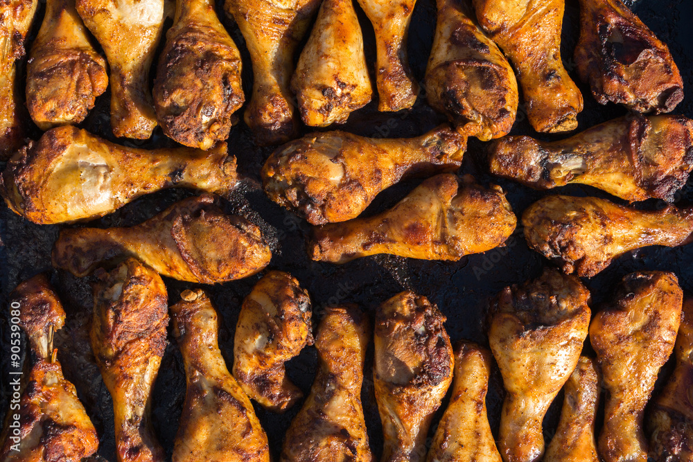 group of chicken legs being barbequed