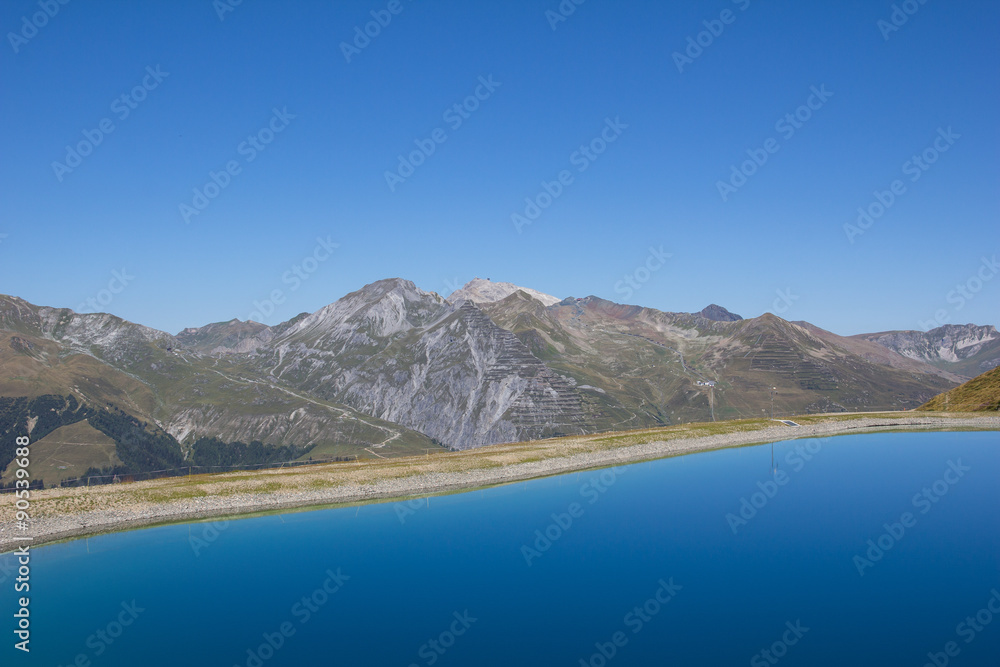 Water Reservoir Lake On Mt. Jakobshorn In Davos Graubünden Switzerland In Summer