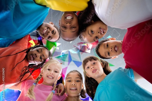 Composite image of elementary pupils smiling