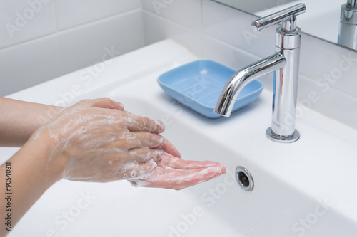 Washing of hands with soap under running water 1