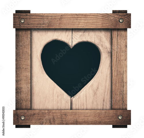 Heart shape cut on wooden planks and screwed frame