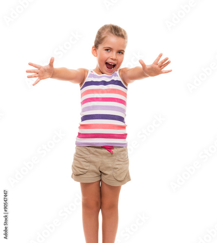 cute little girl standing on white stretch her arms forward