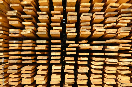 Wooden boards stacked at the timber yard. Texture