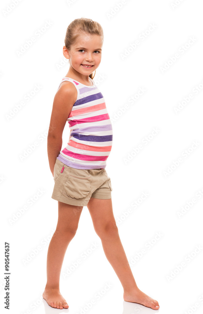 cute little girl standing on white holding hands behind back cute little girl standing on white holding hands behind back