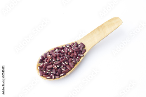 Red beans on wooden spoon isolated on white background