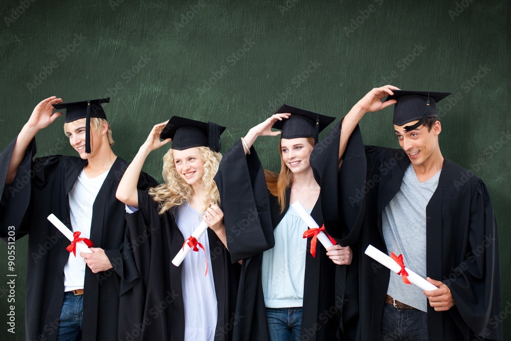 Obraz premium Composite image of group of teenagers celebrating after graduation