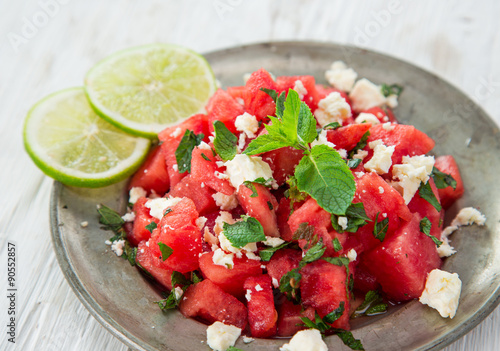Fresh salad with water-melon, feta cheese, lime and mint.