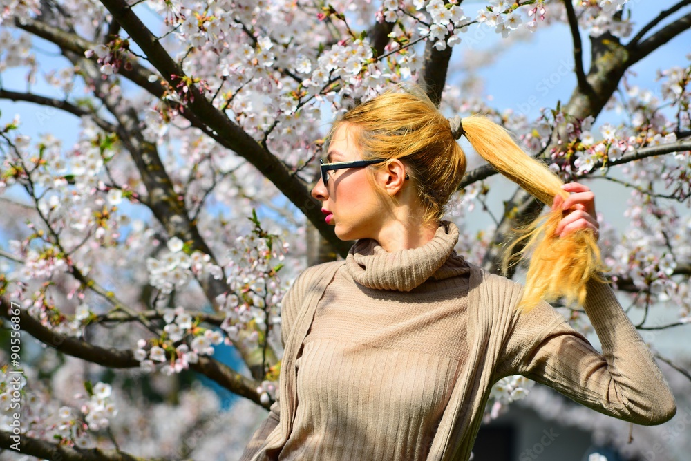 Young girl posing in the sakura garden Young girl posing in the sakura garden