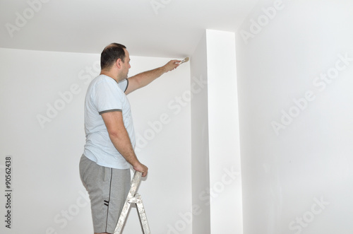 Man painting wall