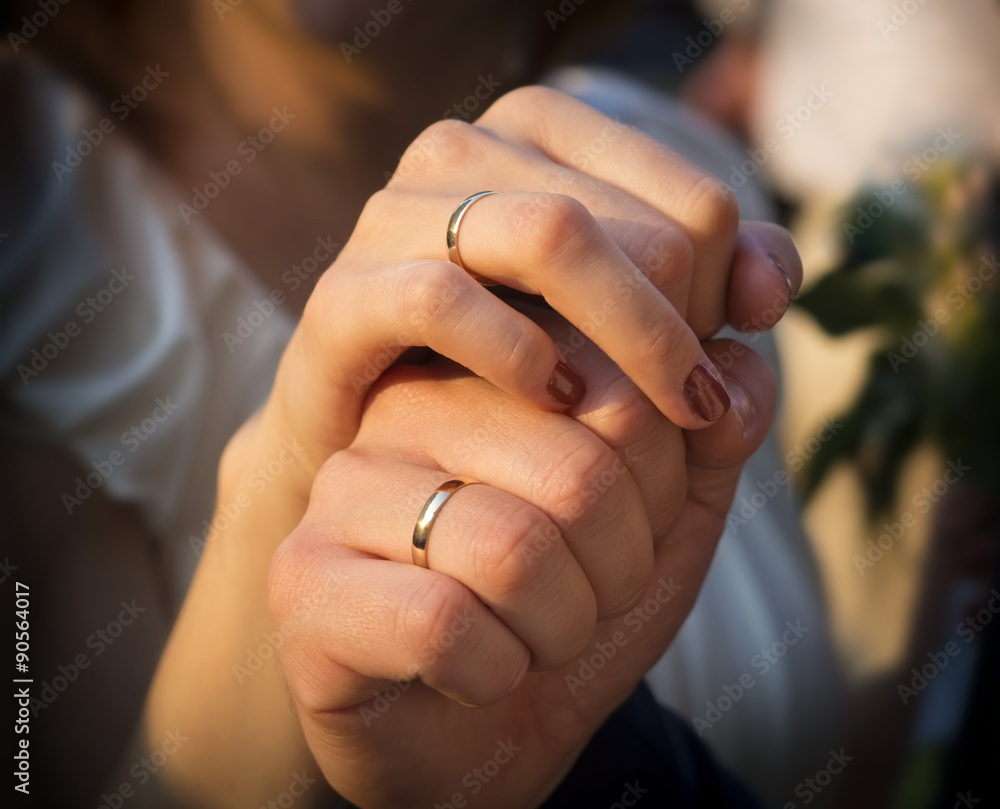 newly wed couple holding each other by their hands newly wed couple holding each other by their hands