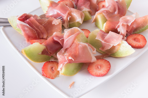 ham and melon on a plate