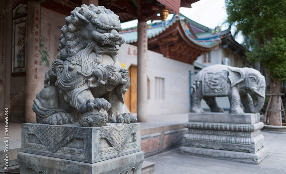 Stone sculptures of the holy animals. Entrance to the South Putuo (Nanputuo) temple. China