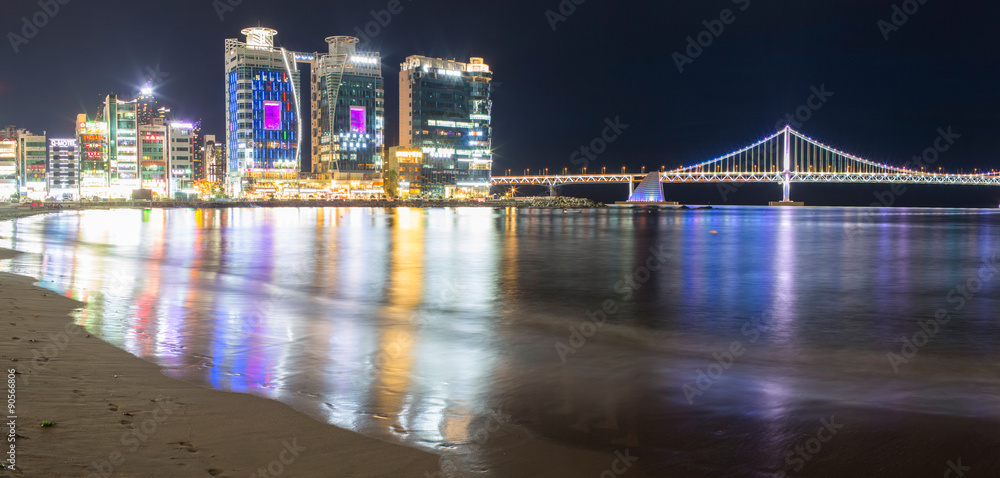 Gwangalli Beach in the nighttime with skyscrapers and city quay. Busan city Gwangalli Beach in the nighttime with skyscrapers and city quay. Busan city
