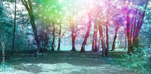 Magical Spiritual Woodland Energy Background - Jade blue colored woodland scene with rainbow sparkles depicting supernatural energy  