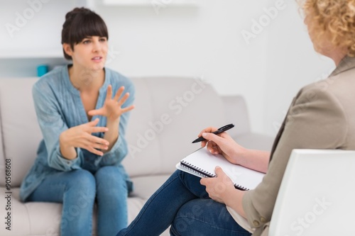  Psychologist talking with her depressed patient photo