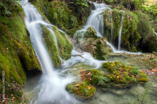 Fototapeta Naklejka Na Ścianę i Meble -  Beautiful autumn creek with a little cascade. 