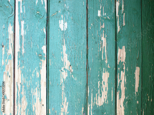 Detail of a green fence from wooden planks