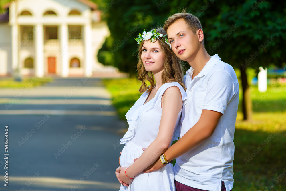 Portrait of beautiful loving couple awaiting baby. Husband and Portrait of beautiful loving couple awaiting baby. Husband and