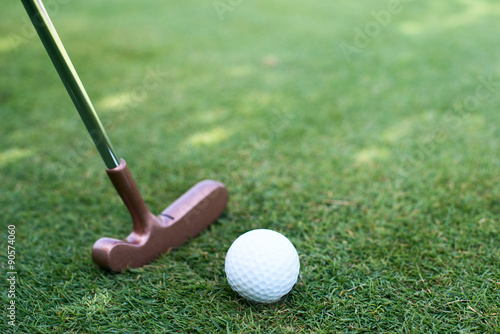 close of putter and ball