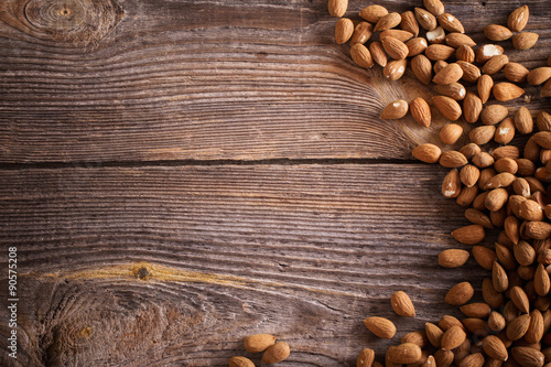 Almonds on wooden background