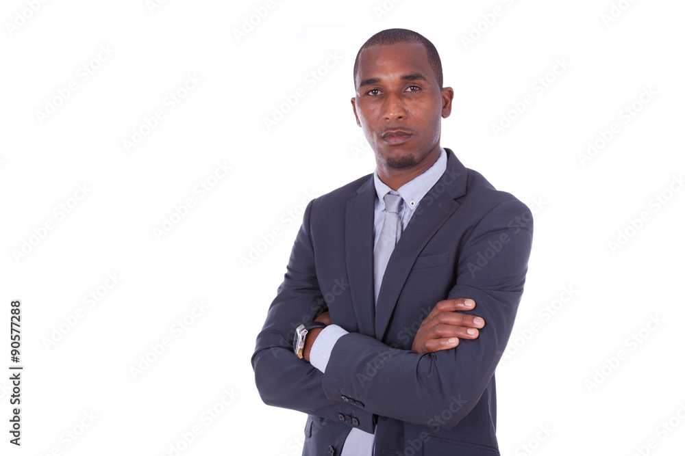 Unhappy African american business man with folded arms over whit Unhappy African american business man with folded arms over whit