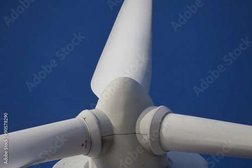 Wind mill turbine over the blue sky