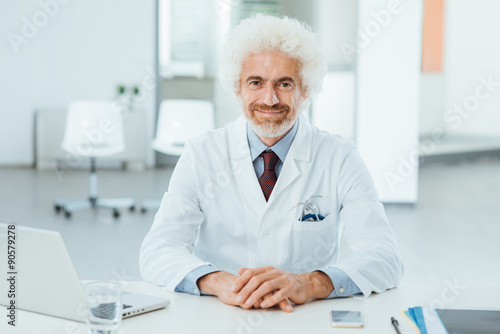 Doctor at desk posing