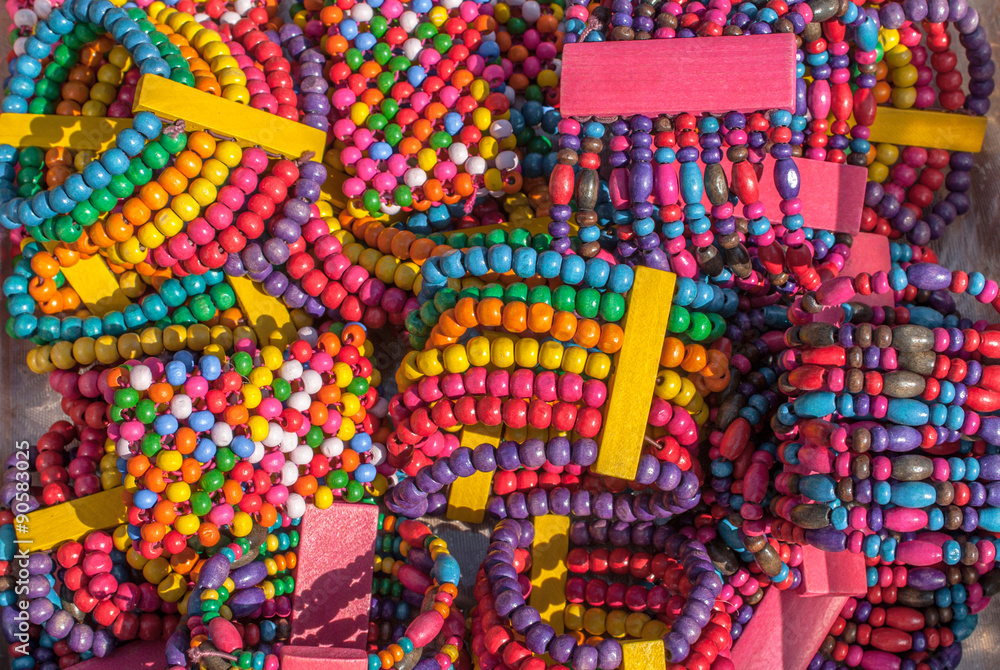 bracelets handmade wooden multi colored beads texture background