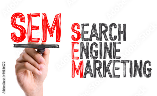 Hand with marker writing the word Search Engine Marketing photo