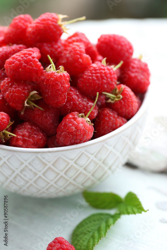 Fresh raspberries in bowl, closeup
