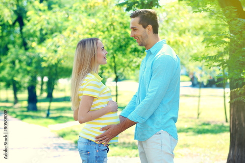 Young pregnant woman with husband in park © Africa Studio