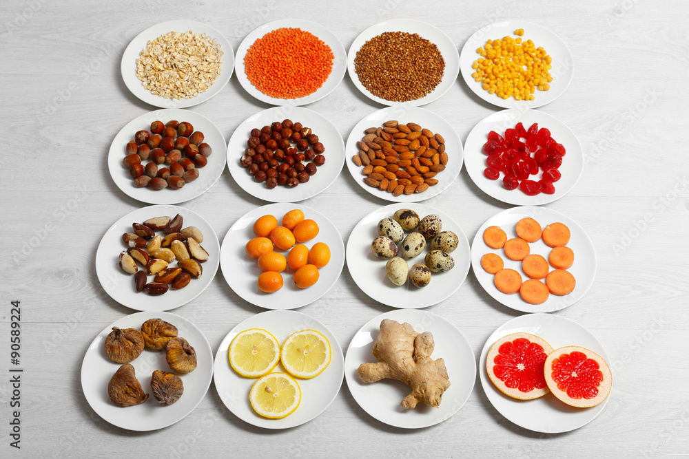 Set of orange products on wooden background Set of orange products on wooden background