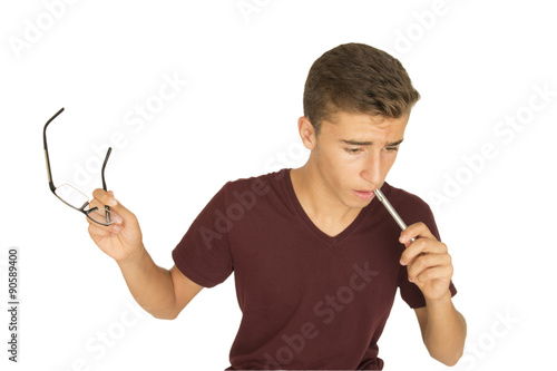 genç erkek stresli kalemini ısırıyor photo
