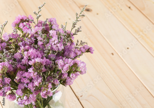 statice flower bouquet  on wood background